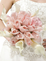 Wedding bouquet of cream roses and calla lilies 