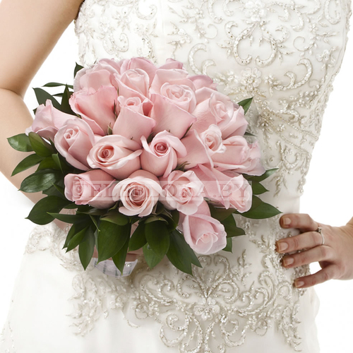 Wedding bouquet of cream roses and ruskus 'Fragrance'