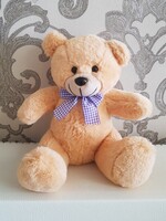 Soft toy teddy bear with bow, light brown