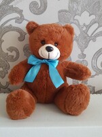 Soft toy teddy bear with bow, brown